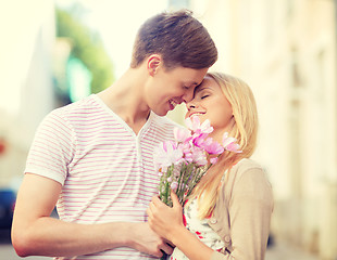 Image showing couple with flowers in the city