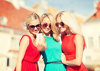 Image showing beautiful girls taking picture in the city