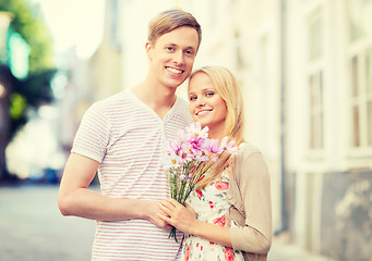 Image showing couple with flowers in the city