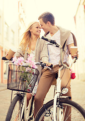 Image showing couple with bicycles in the city