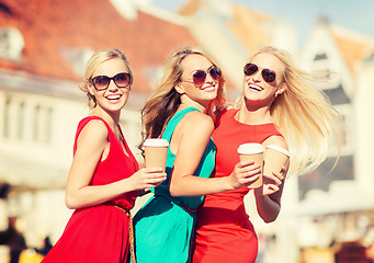Image showing women with takeaway coffee cups in the city