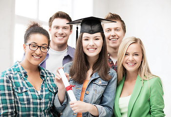 Image showing student girl in graduation cap with diploma