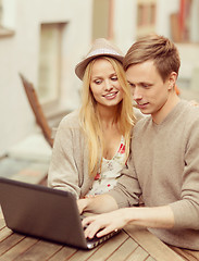 Image showing couple with laptop in cafe