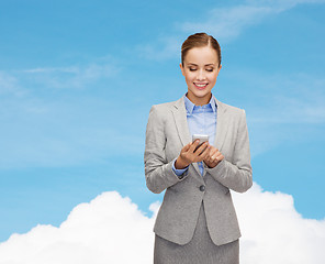 Image showing young smiling businesswoman with smartphone