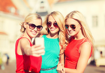 Image showing beautiful girls taking picture in the city