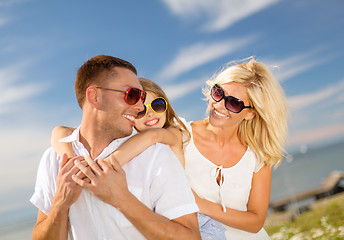 Image showing happy family in sunglasses having fun outdoors