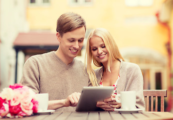 Image showing couple with tablet pc in cafe