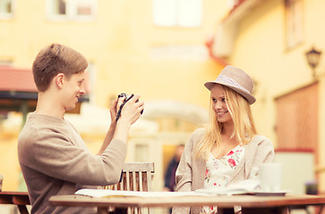 Image showing couple taking photo picture in cafe