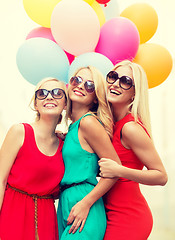 Image showing beautiful girls with colorful balloons in the city