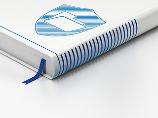 Image showing Finance concept: closed book, Folder With Shield on white background