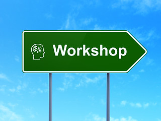 Image showing Education concept: Workshop and Head With Finance Symbol on road sign background