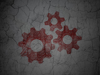 Image showing Advertising concept: Gears on grunge wall background