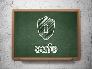 Image showing Privacy concept: Shield With Keyhole and Safe on chalkboard background