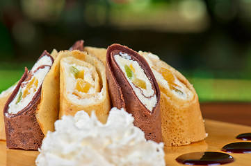 Image showing pancake roll with marmalade