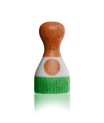 Image showing Wooden pawn with a flag painting