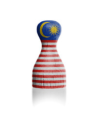 Image showing Wooden pawn with a flag painting