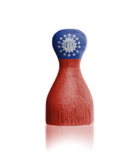 Image showing Wooden pawn with a flag painting