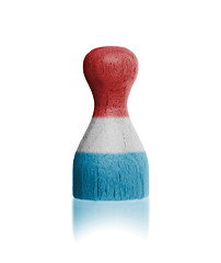 Image showing Wooden pawn with a flag painting