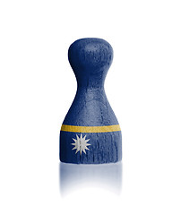 Image showing Wooden pawn with a flag painting