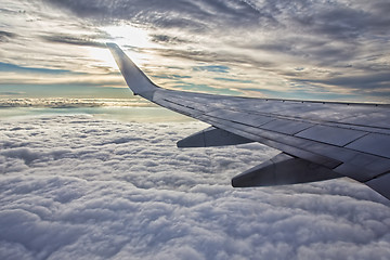 Image showing Sunset, clouds and wing