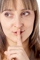 Image showing Attractive woman with finger on lips