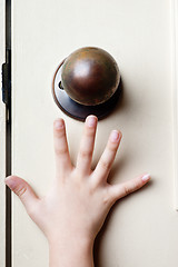 Image showing Reaching for door knob