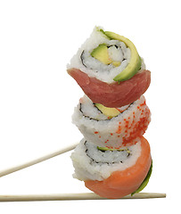 Image showing Sushi Rolls With Red Fish And Avocado