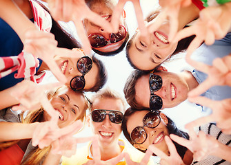 Image showing group of teenagers showing finger five gesture