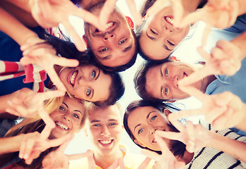 Image showing group of teenagers showing finger five gesture