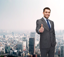 Image showing handsome buisnessman showing thumbs up