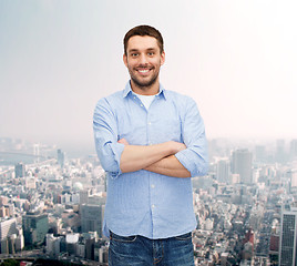 Image showing smiling man with crossed arms