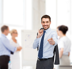 Image showing handsome buisnessman with jacket over shoulder