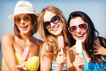 Image showing girls in bikinis with ice cream on the beach