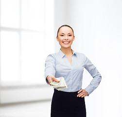 Image showing young businesswoman with dollar cash money