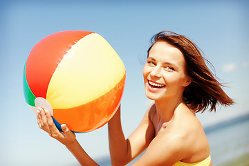 Image showing girl in bikini playing ball on the beach