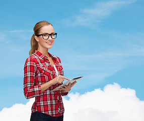 Image showing smiling girl in eyeglasses with tablet pc computer