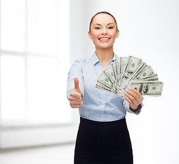 Image showing young businesswoman with dollar cash money