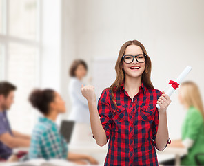 Image showing smiling female student in eyeglasses with diploma