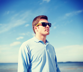 Image showing man in sunglasses on the beach