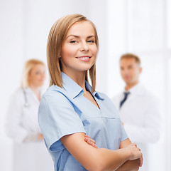 Image showing smiling female doctor or nurse