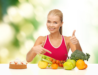 Image showing woman pointing at healthy food