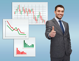 Image showing handsome buisnessman showing thumbs up