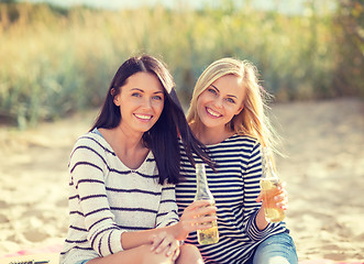 Image showing girls with drinks on the beach