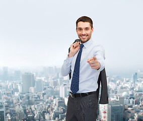 Image showing handsome buisnessman with jacket over shoulder