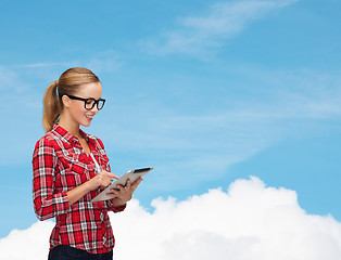 Image showing smiling girl in eyeglasses with tablet pc computer