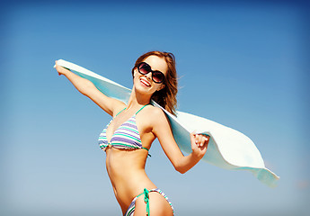 Image showing girl in bikini and shades on the beach