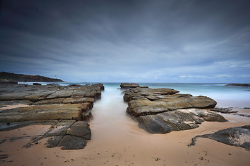 Image showing Stormy beach with natural rock channel Soldiers Beach point