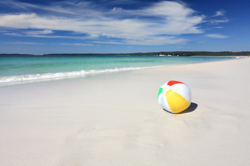 Image showing Colourful beach ball on the seashore by the ocean