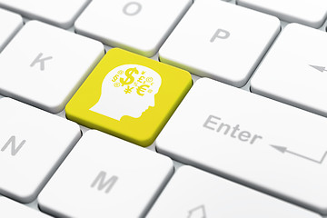 Image showing Advertising concept: Head With Finance Symbol on computer keyboard background