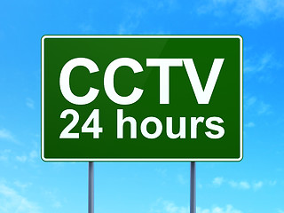 Image showing Privacy concept: CCTV 24 hours on road sign background